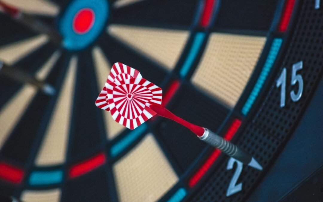 red and white dart on darts board