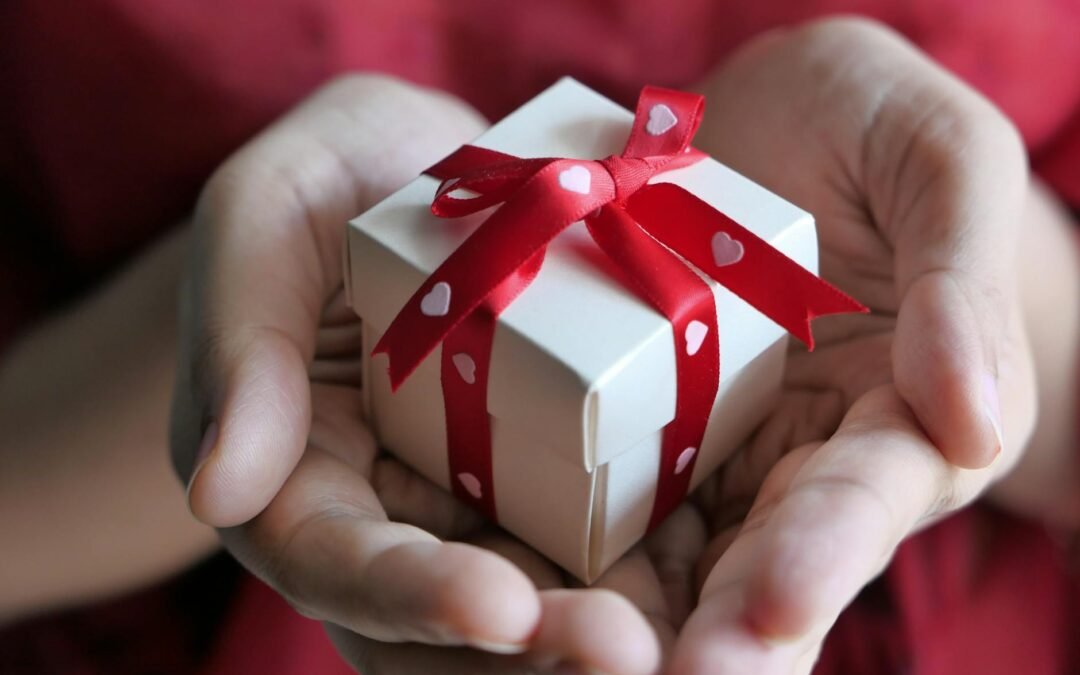 close up shot of a person holding a gift box