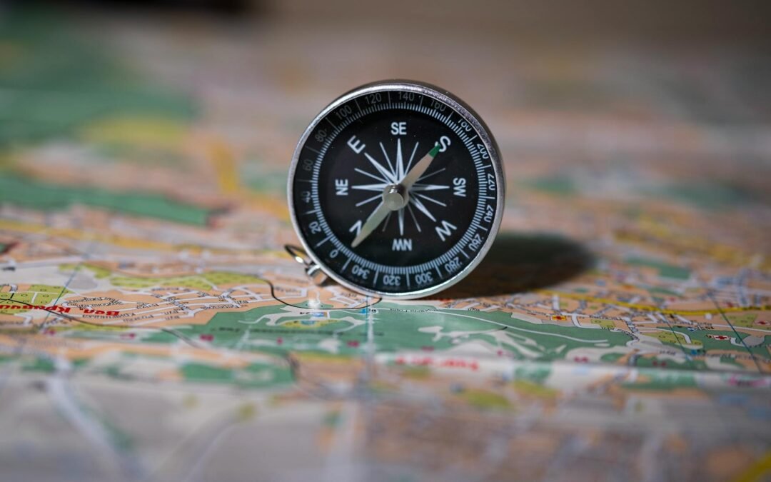 compass on the background of the map travel concept route planning find your direction in life