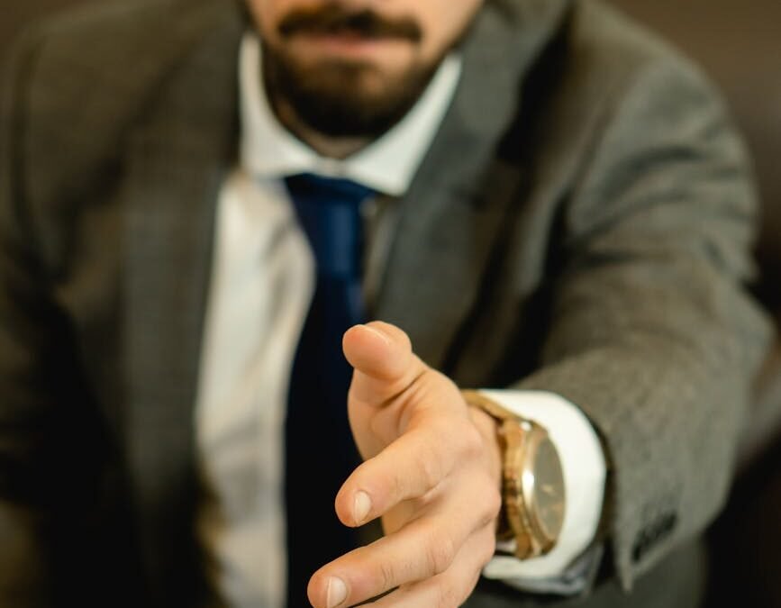 man reaching his hand for handshake