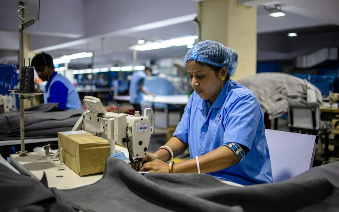 female factory worker sewing in textile industry