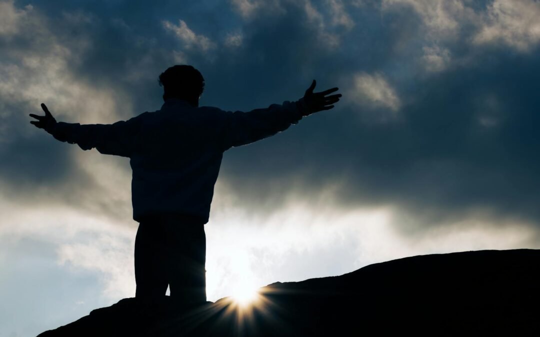 silhouette of person embracing sunrise in tamil nadu