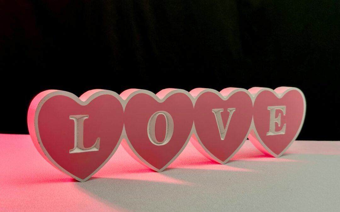 pink heart shaped love sign with red glow