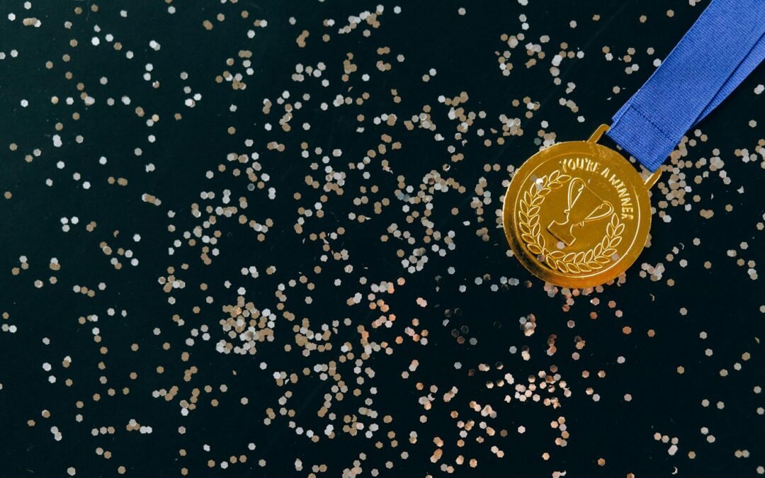 close up shot of a gold medal on a black surface