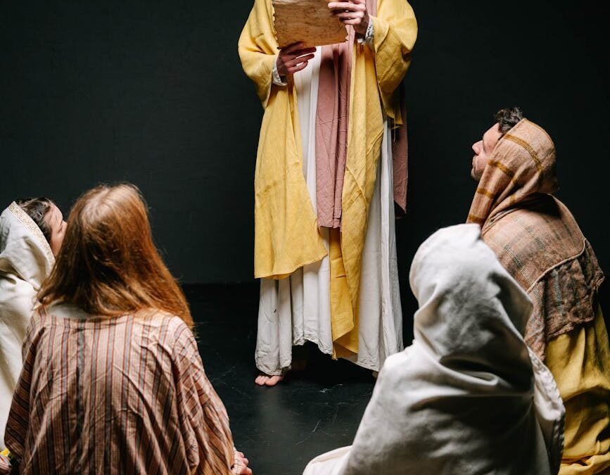 man and people in jesus christ and apostles costumes