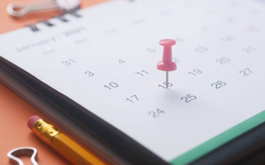 pink pish pin on a calendar