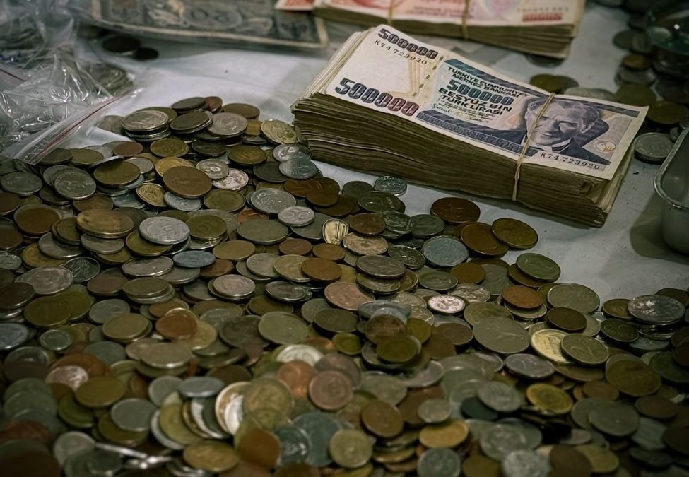 coins and stacks of vintage currency notes