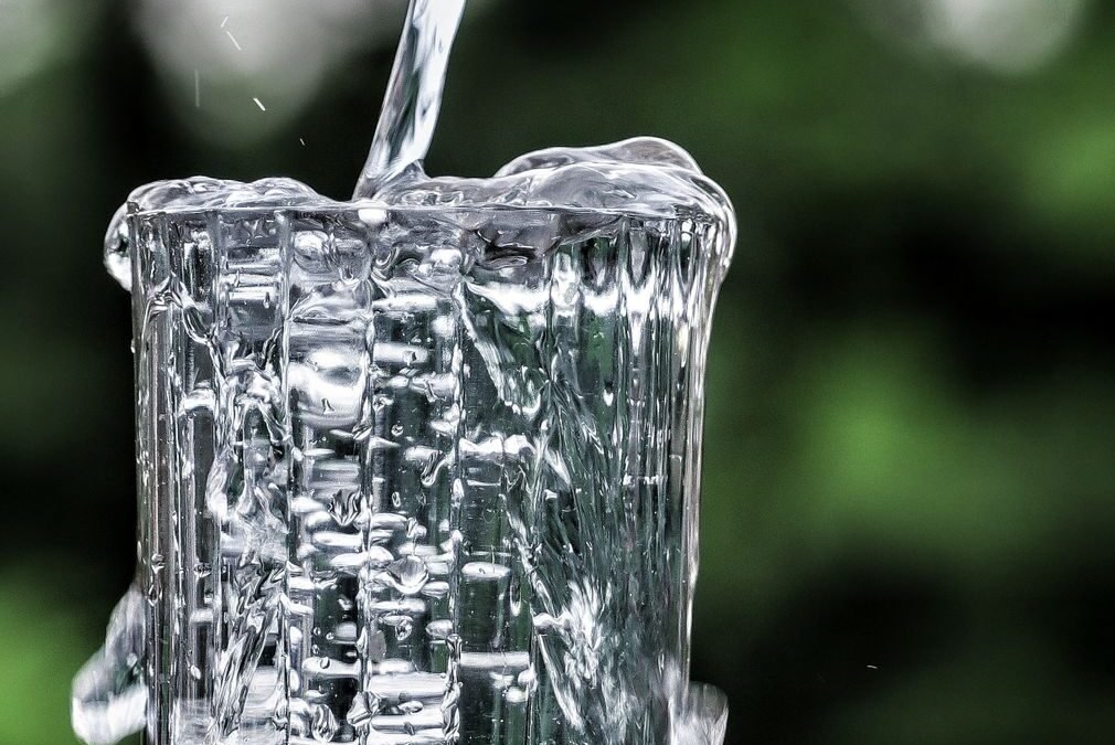 pouring water to glass
