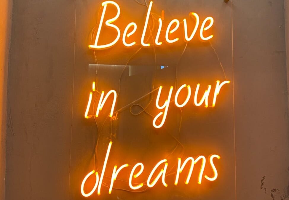 a neon signage on the wall
