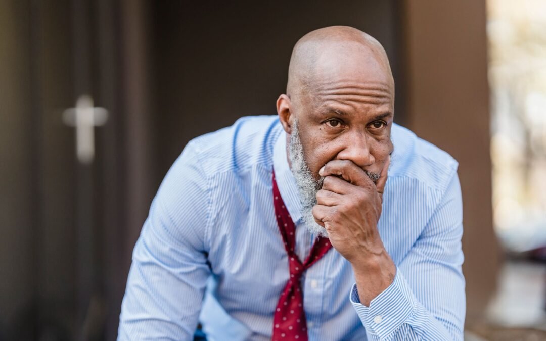 concerned black businessman in city