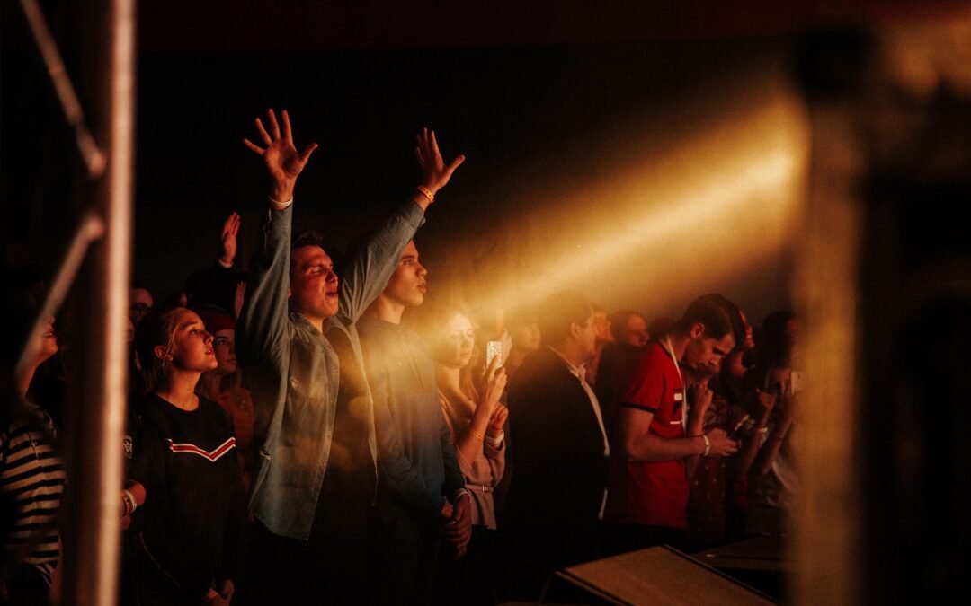 people dancing on concert in dark