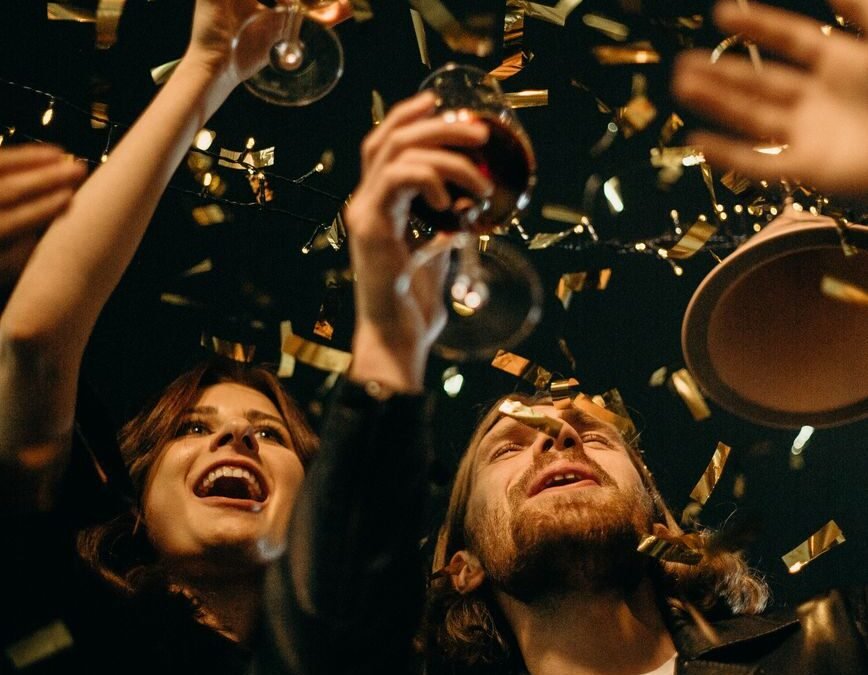 people holding wine glasses
