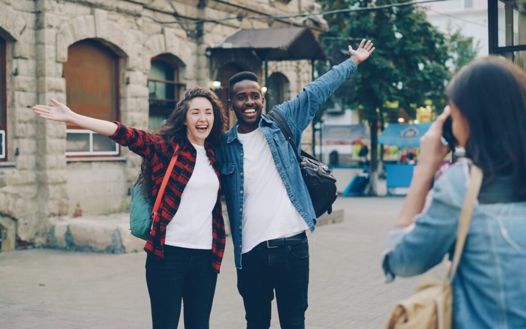 happy tourists posing for a street photo