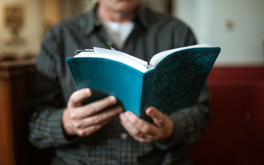 close up shot of a person reading a bible