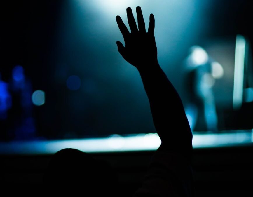 person raising his right hand