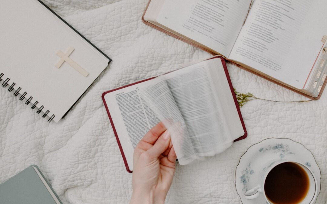 person holding white book page
