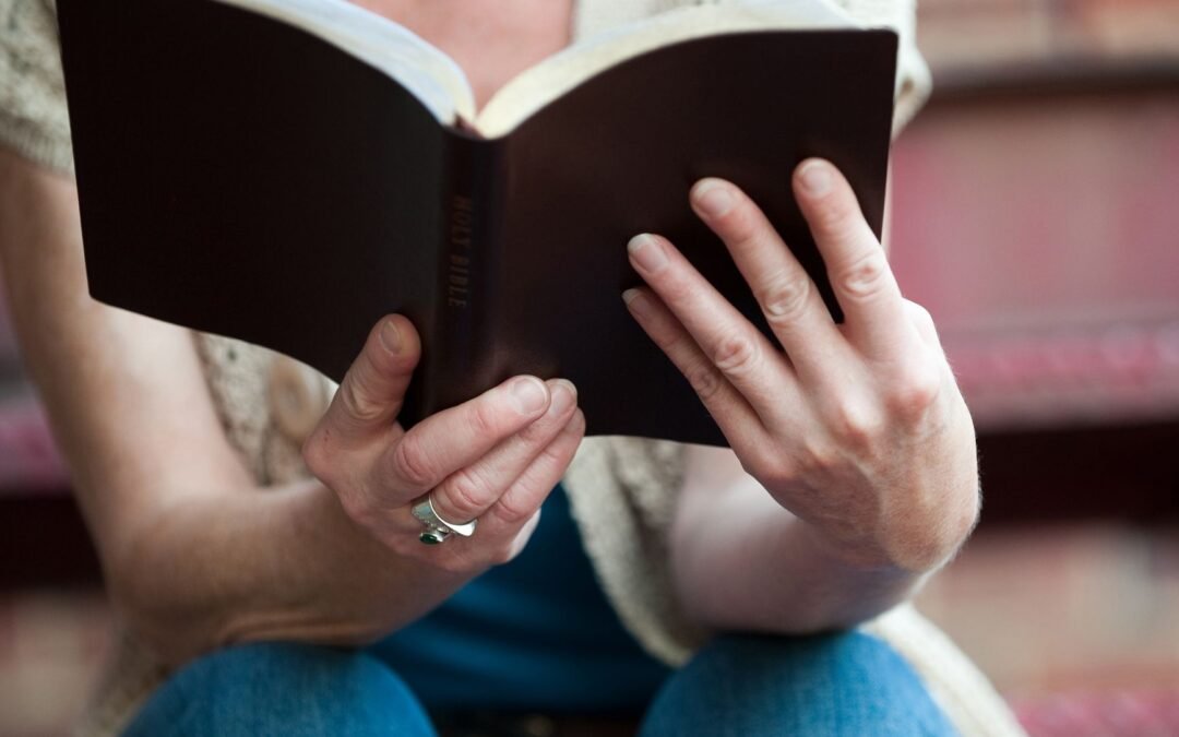 a woman reading bible