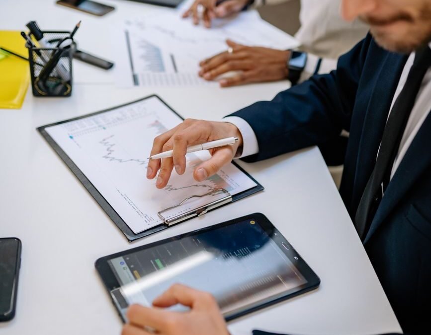 a businessman looking at a tablet while working at an office