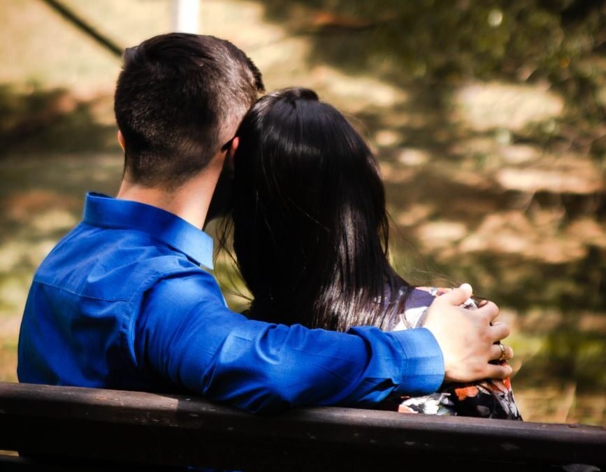 a couple sitting on the bench