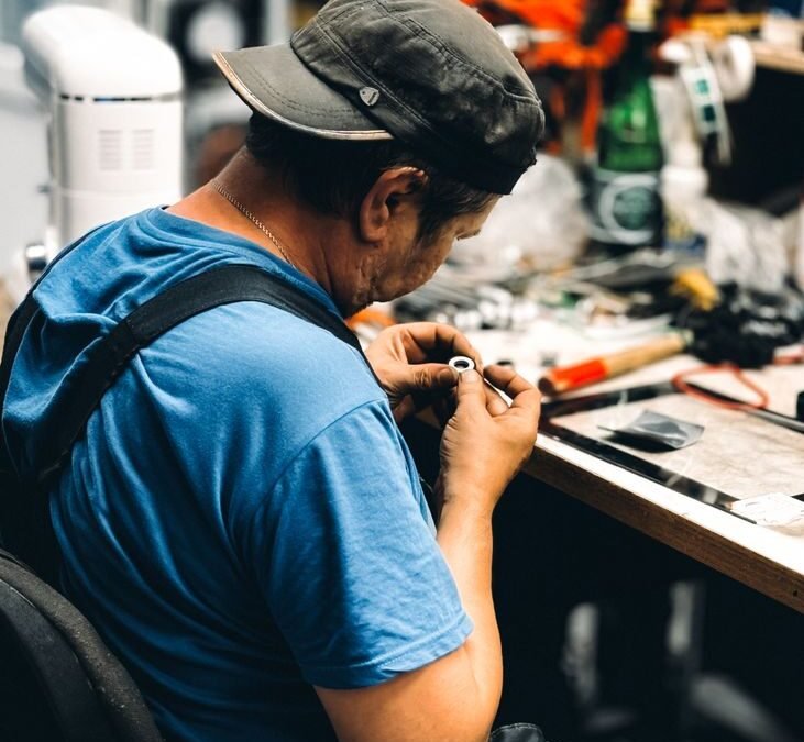 skilled craftsman working at workshop desk