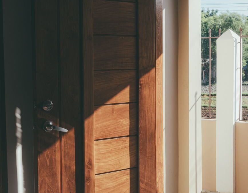 wooden door with sunlight streaming inside