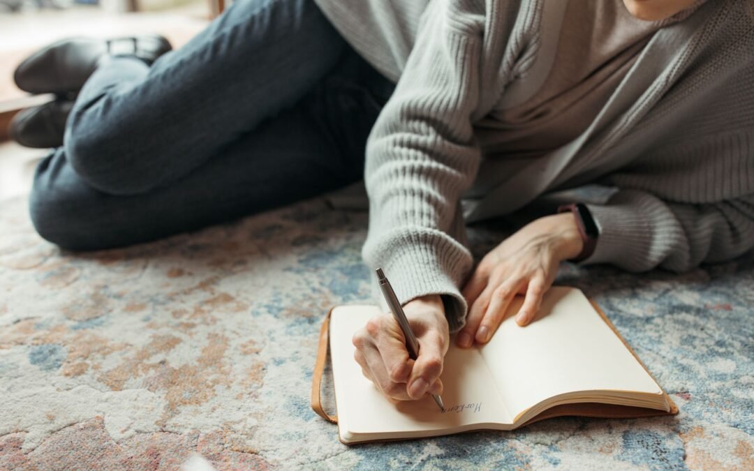 close up shot of person writing a diary